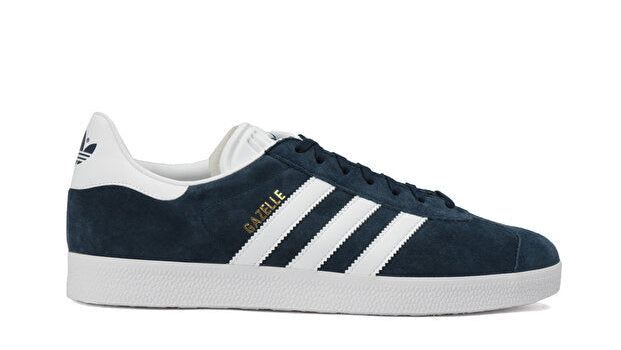 Navy blue and white Adidas sneaker on a white background