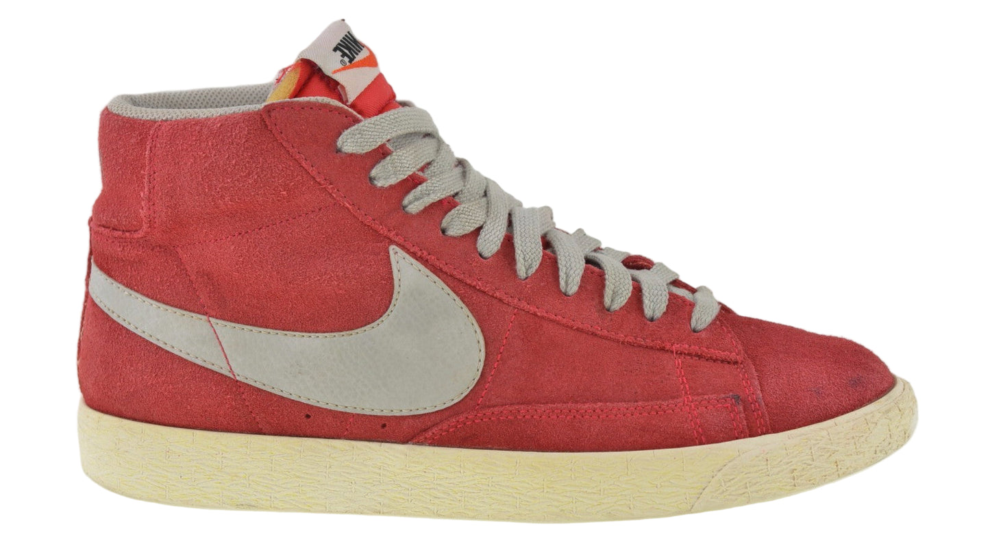 Red high-top sneaker with a white logo on a white background