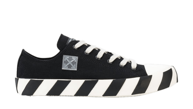 Black sneaker with white stripes on a transparent background