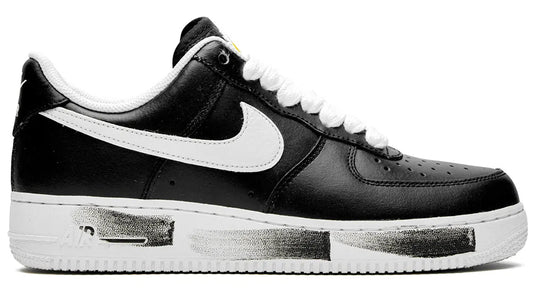 Black and white sneaker with a prominent logo on a white background