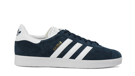 Navy blue and white Adidas sneaker on a white background