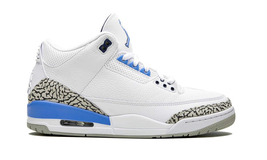 White sneaker with blue accents on a white background