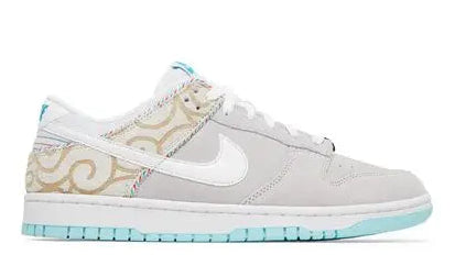 Gray sneaker with a white Nike logo on a white background