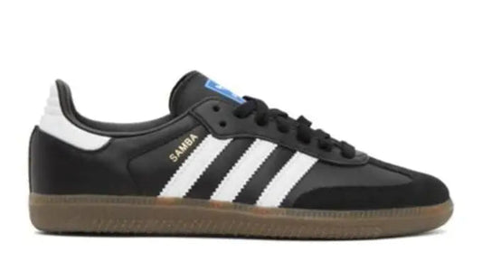 Black Adidas sneaker with white stripes on a white background