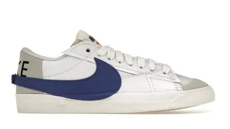 White sneaker with blue swoosh logo on a white background