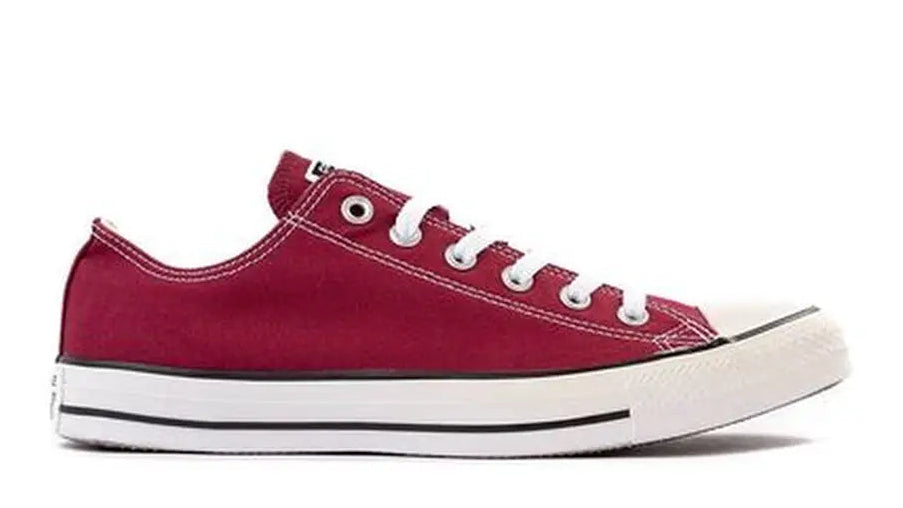 Maroon sneaker with white laces on a white background