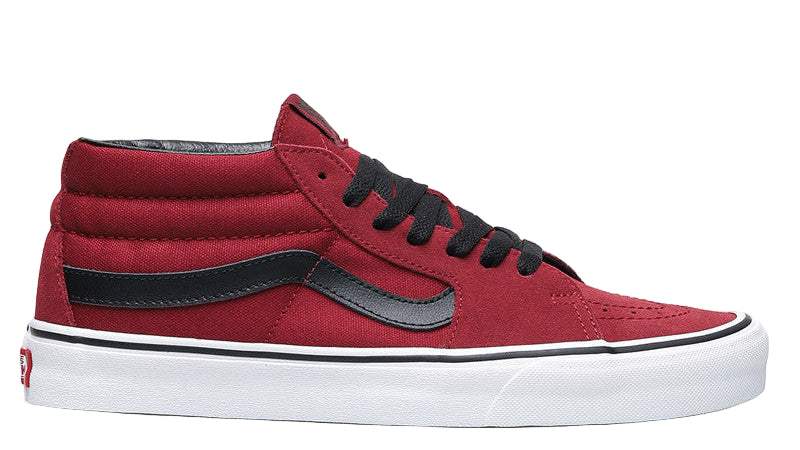 Red high-top sneaker with black laces and gray accents on a white background