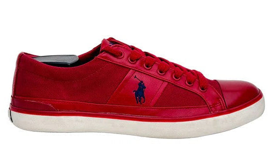 Red sneaker with a logo on a white background