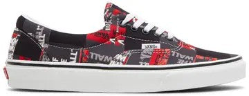 Black and red patterned sneaker with white sole on a black background
