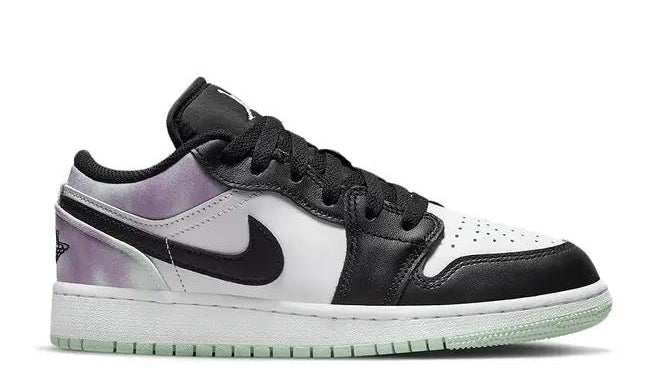 Black and white sneaker with a purple gradient sole on a white background