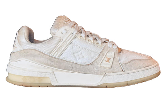 White sneaker on a white cylindrical stand