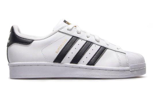 White sneaker with black stripes on a white background