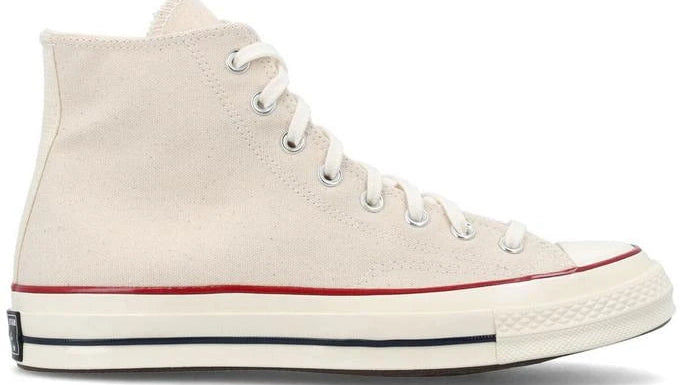 White high-top sneaker with red accents on a white background