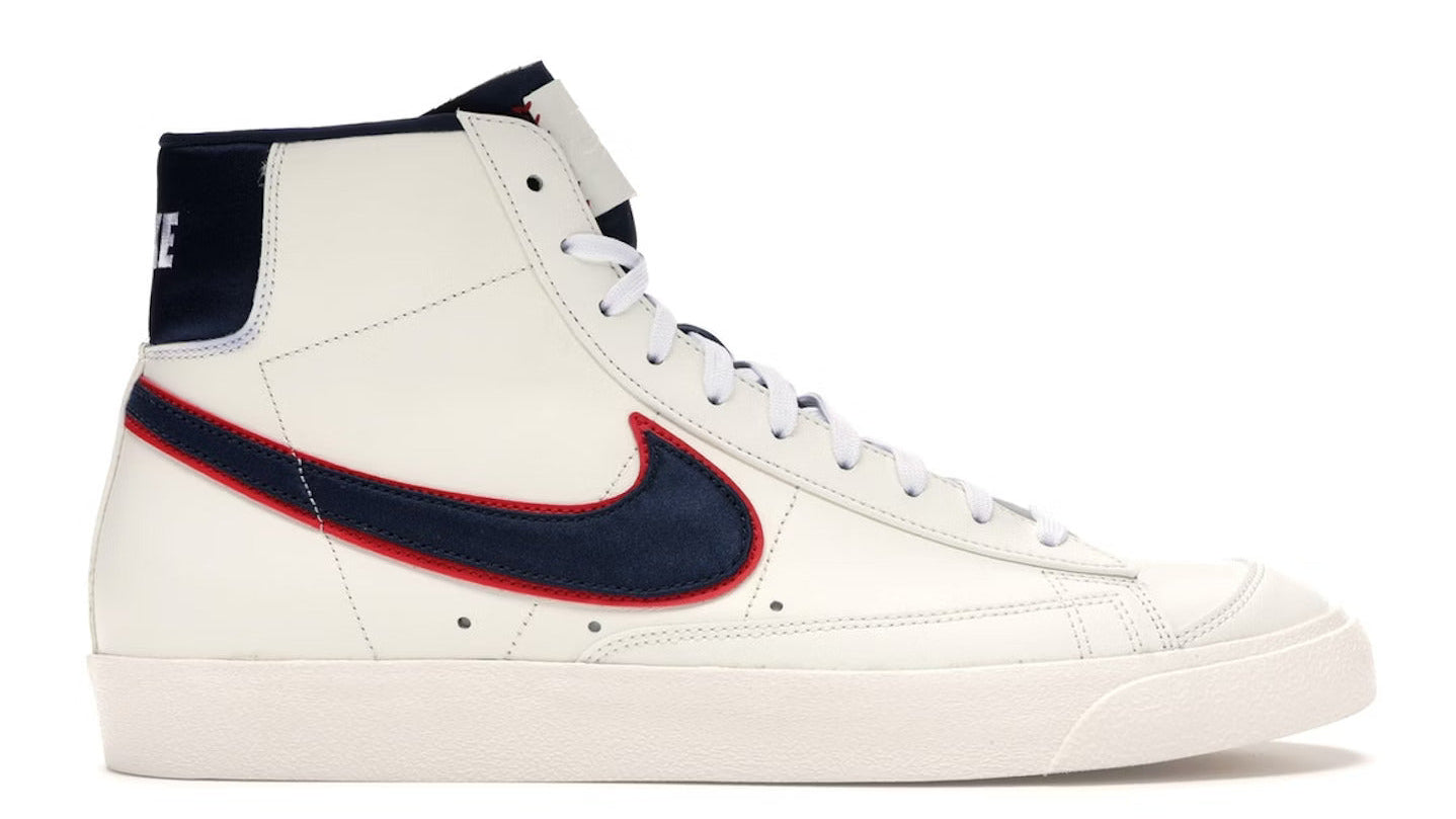 White sneaker with navy and red accents on a white background