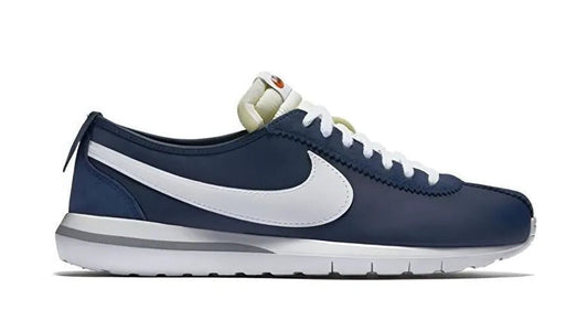 Navy blue and white sneaker with Nike logo on a white background