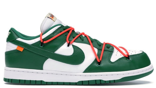 Green and white sneaker with red laces on a white background